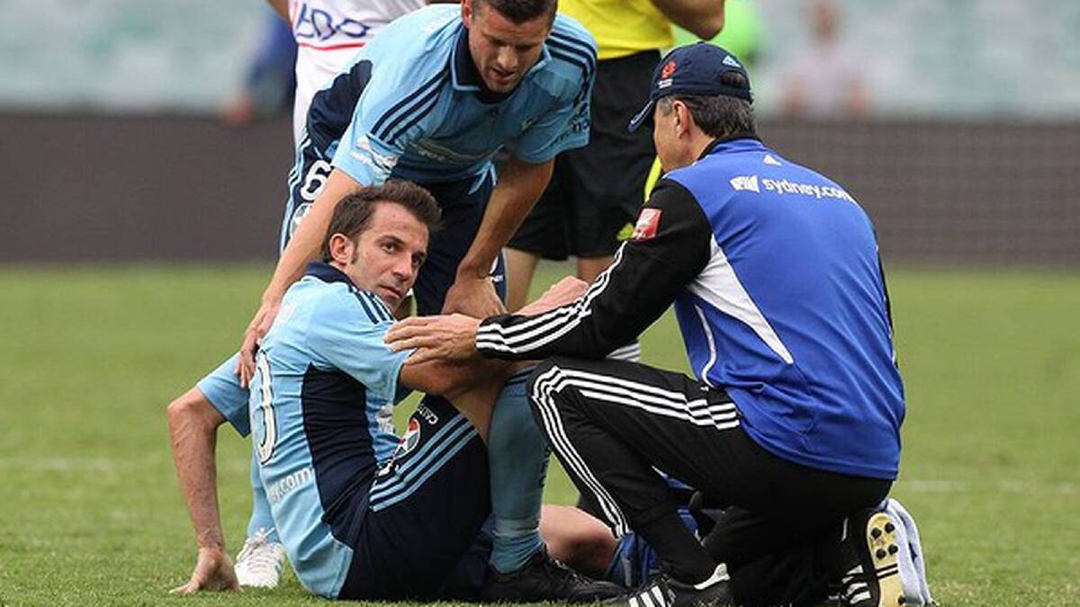 Alessandro Del Piero is assisted off the field with a leg injury. Photo: Brendan Esposito