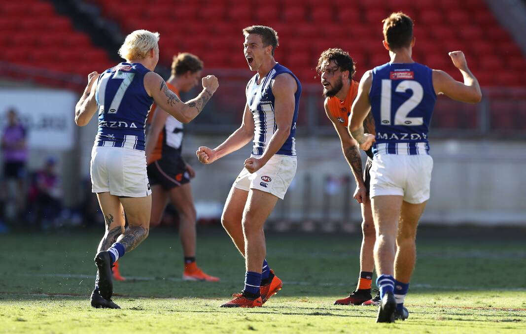 ROO BEAUTY: Kangaroos defender Jasper Pittard and Trent Dumont celebrate Pittard kicking a goal against the Giants on Sunday at Giants Stadium. Picture: Mark Koelbe/Getty Images