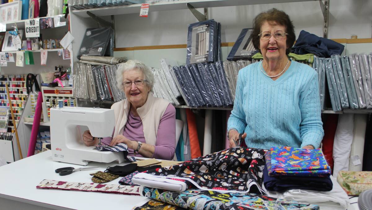 BUSIER THAN EVER: Nola Kite has been busy making face masks and trolley covers, while Sylvia's Fabrics owner Sylvia Broderick has been flat-out selling material and elastic to people to make their own masks.