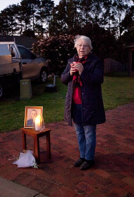 LONE MOURNER: Sheila McConnell pays tribute to her father at dawn in her driveway on Anzac Day, 2020. Photo supplied