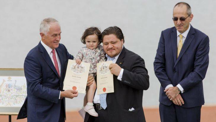 Prime Minister Malcolm Turnbull announcing citizenships to Diego Torre and his daughter Johanna. Photo Jamila Toderas