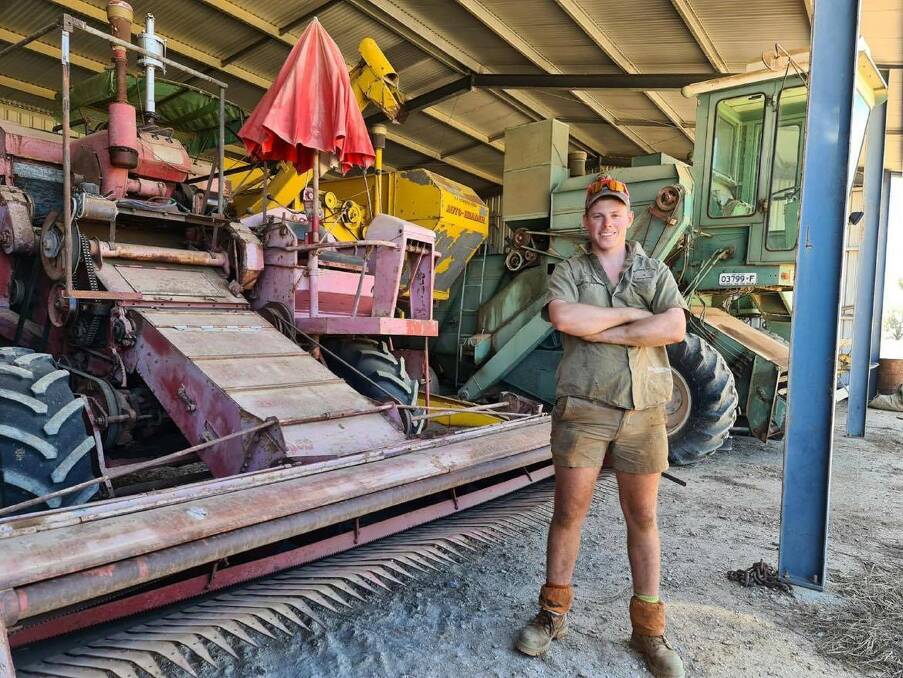 Hugh Macague, 23, Rochester, Victoria with some of his restored vintage headers including a International A8-2, Connor Shea Auto header and David Shearer XP88.
