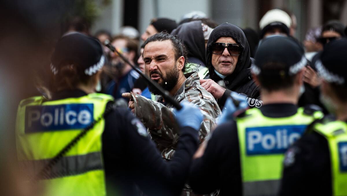 Anti-lockdown protesters clash with members of Victoria Police in Richmond. Picture: Getty