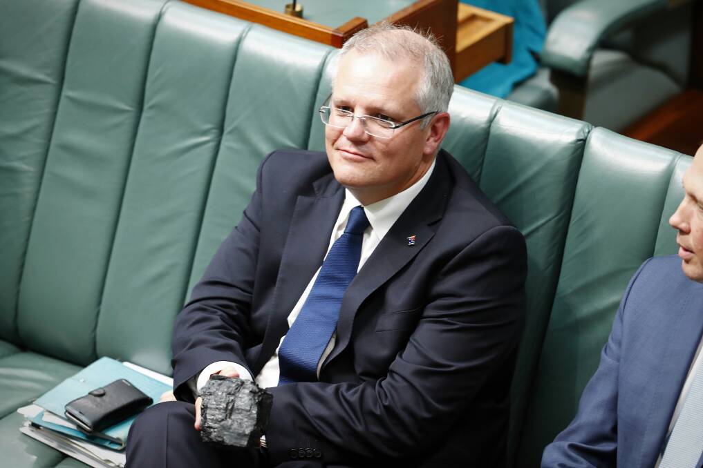 Treasurer Scott Morrison with a lump of coal during Question Time at Parliament House in Canberra, on Thursday 9 February 2017. fedpol Photo: Alex Ellinghausen auspol2017