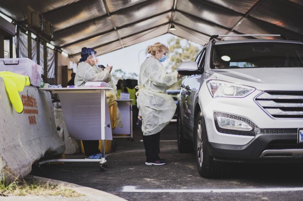 Nurse Di Allende conducts a COVID-19 test at the drive-in COVID-19 testing site in Kambah. Picture: Dion Georgopoulos