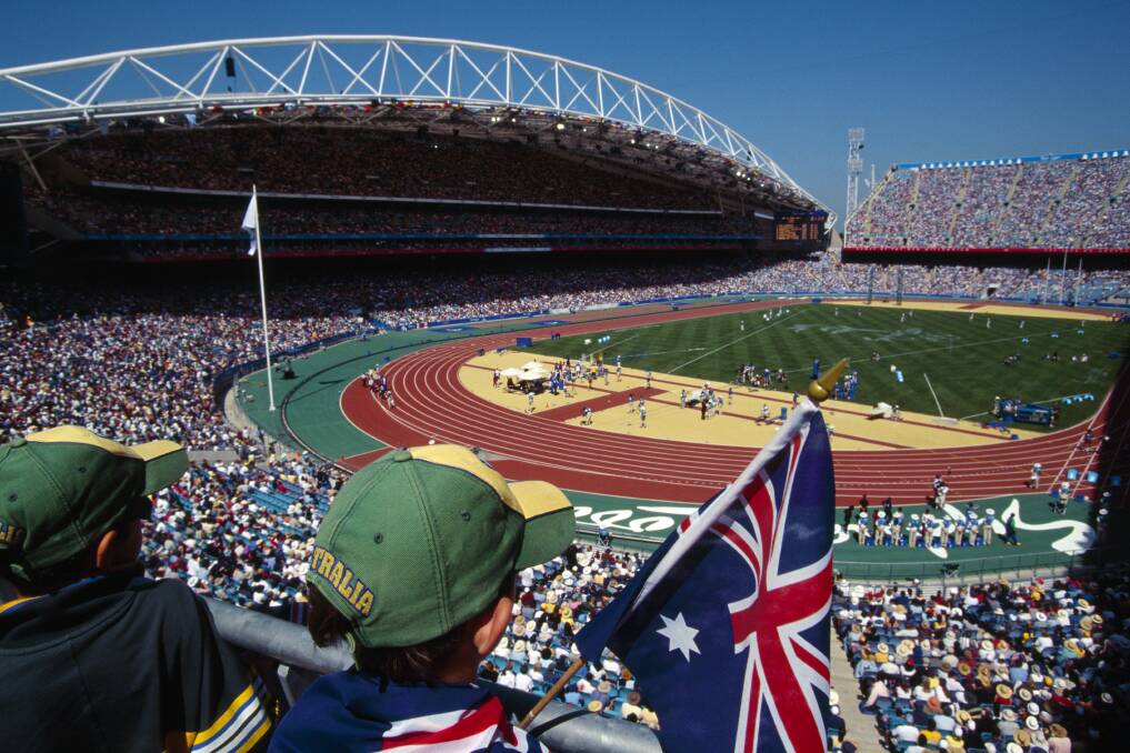 Fans enjoy the action at a packed Sydney Olympic Stadium during the 2000 Games. Picture: Getty Images