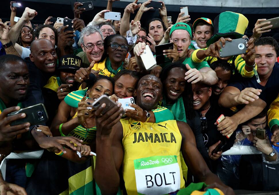 Usain Bolt of Jamaica celebrates with fans after winning the men's 200m final at the Rio 2016 Olympic Games. Picture: Getty Images