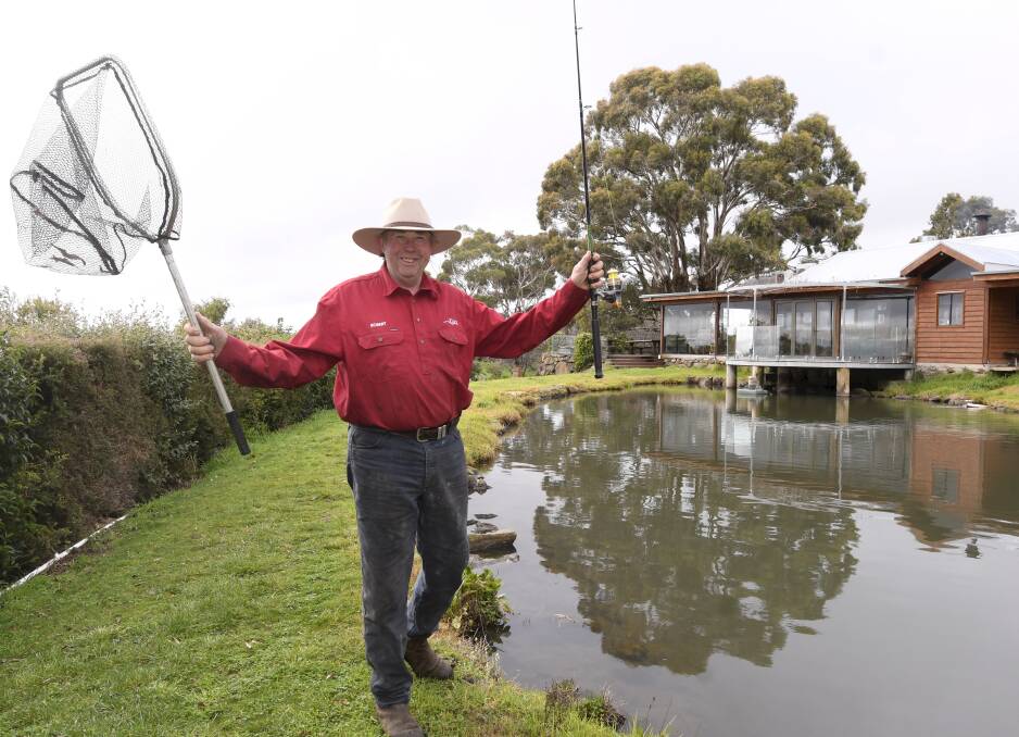 CATCH: Tuki Trout Farm owner Robert Jones is relishing welcoming visitors back to the venue he and wife Janet have run for 35 years. Picture: Lachlan Bence
