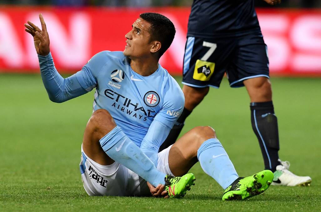 Not Timmy!: The sight no Socceroos fan wanted to see - Tim Cahill with an injured ankle. Picture: AAP Image/Tracey Nearmy