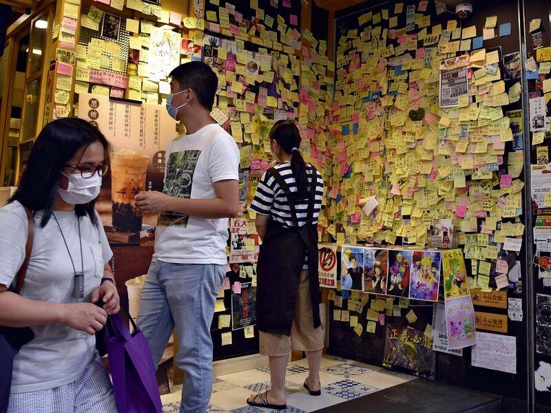 Many shops in Hong Kong are taking down their "Lennon Walls" full of protest Post-it notes.