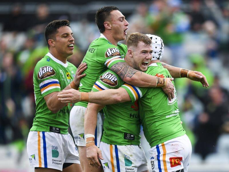 Hudson Young (2-r) celebrates a try in Canberra's 26-14 NRL win over the Warriors on Sunday.
