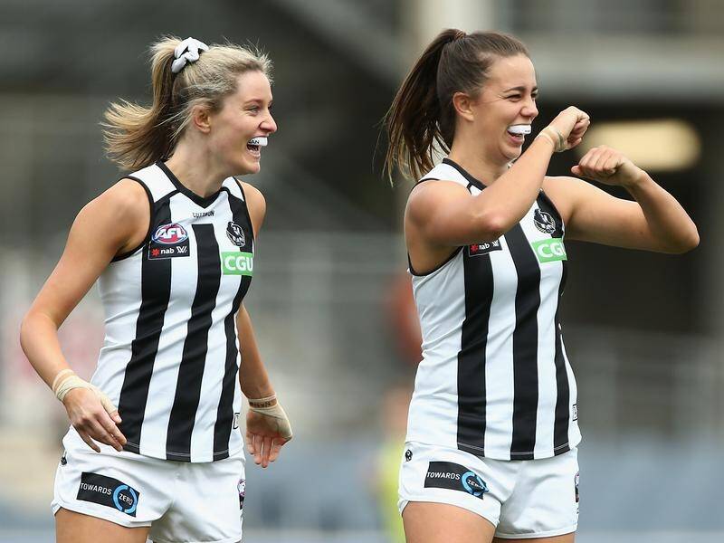 Chloe Molloy (R) booted two goals in Collingwood's AFLW win over Geelong.