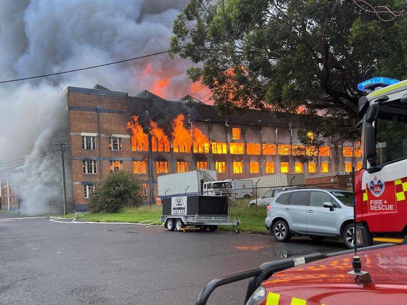 Firefighters have contained a blaze that broke out in a former wool store in inner Newcastle.