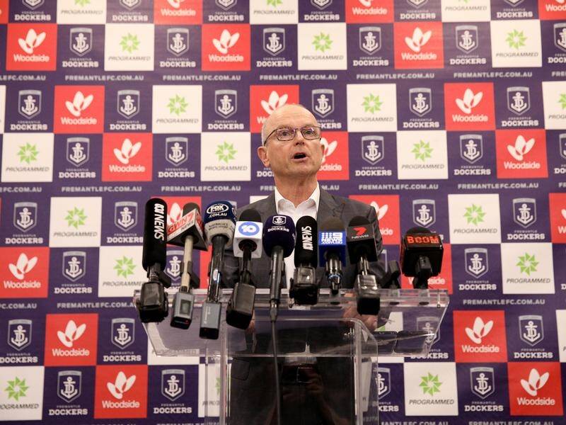 Fremantle Dockers president Dale Alcock has vowed to search far and wide for the club's new coach.