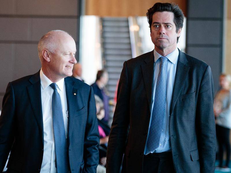 AFL Commissioner Richard Goyder (l) announced a $23-million loss during a COVID-affected season.