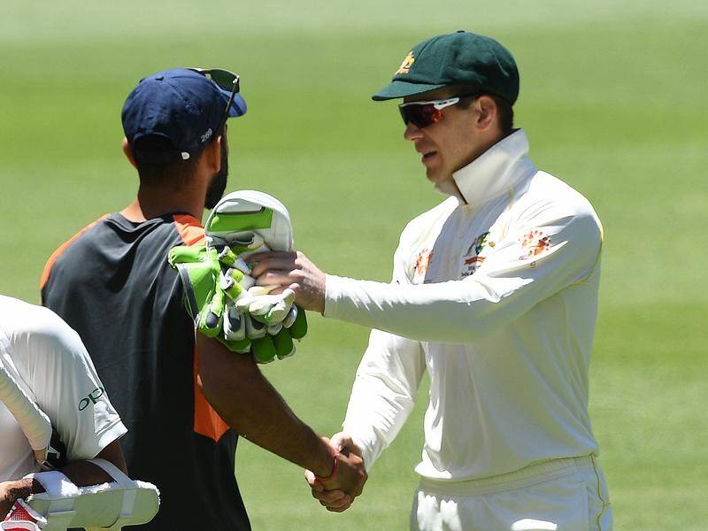 Tim Paine (r) got little back from Virat Kohli (l) when they shook at the end of the second Test.