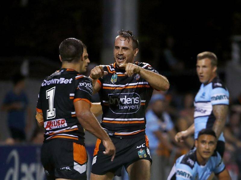 Josh Reynolds (C) is out of the Wests Tigers' NRL season opener with an apparent torn hamstring.