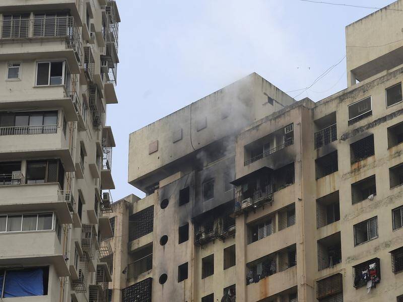The fire was caused by a short-circuit in an air conditioner, Mumbai's mayor says.