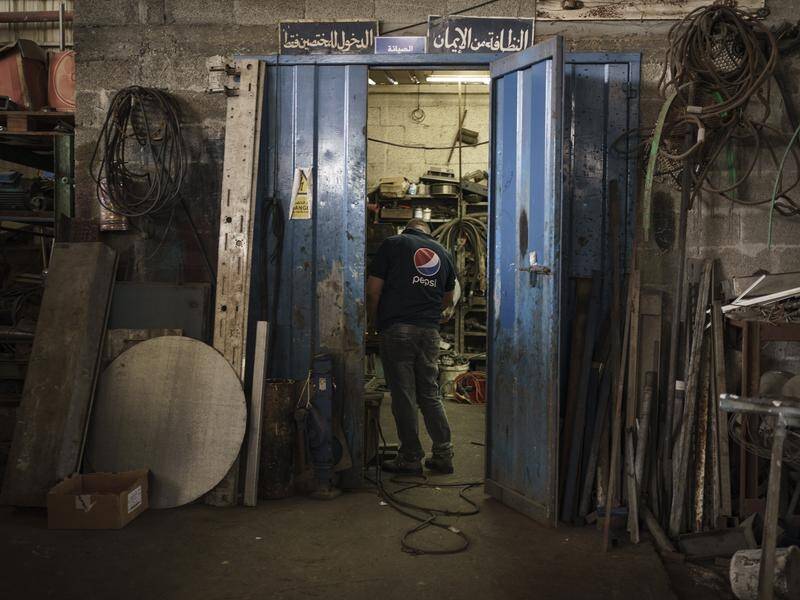 Gaza's Pepsi factory says it is laying off workers because raw materials are not being allowed in.