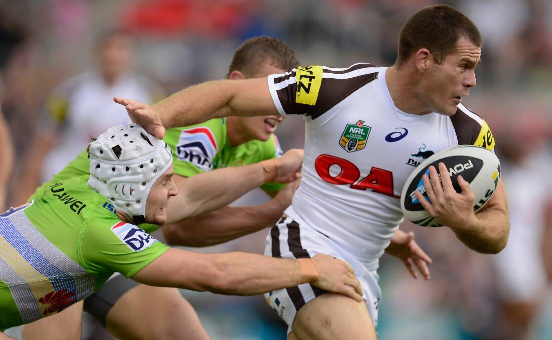 SYDNEY, AUSTRALIA - APRIL 05: Kevin Kingston of the Panthers breaks free from a tackle during the round five NRL match between the Penrith Panthers and Canberra Raiders at Sportingbet Stadium on April 5, 2014 in Sydney, Australia. (Photo by Brett Hemmings/Getty Images)