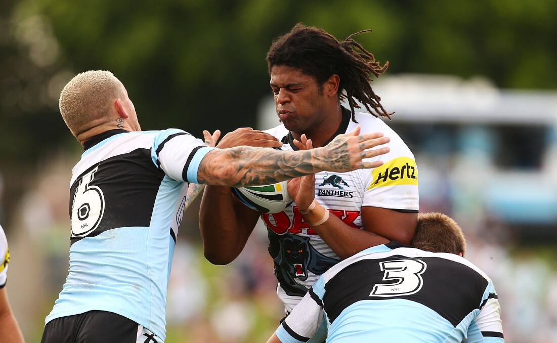 SYDNEY, AUSTRALIA - APRIL 26: Jamal Idris of the Panthers is tackled during the round 8 NRL match between the Cronulla-Sutherland Sharks and the Penrith Panthers at Remondis Stadium on April 26, 2014 in Sydney, Australia. (Photo by Mark Nolan/Getty Images)