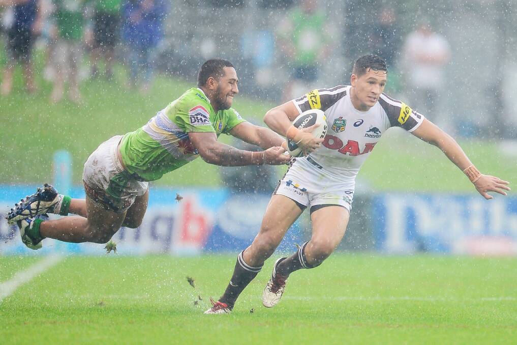 SYDNEY, AUSTRALIA - APRIL 05: Dallin Watene-Zelezniak of the Panthers breaks free from a tackle by Sami Sauiluma of the Raiders during the round five NRL match between the Penrith Panthers and Canberra Raiders at Sportingbet Stadium on April 5, 2014 in Sydney, Australia. (Photo by Brett Hemmings/Getty Images)