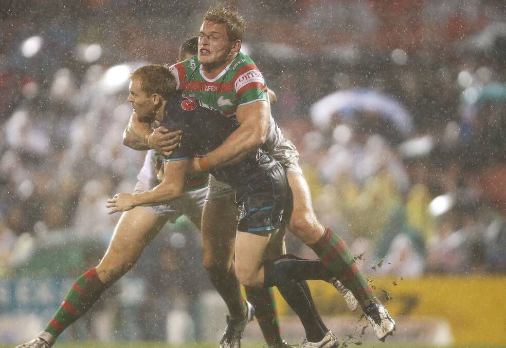 SYDNEY, AUSTRALIA - APRIL 11: Peter Wallace of the Panthers is tackled by Luke Burgess and George Burgess of the Rabbitohs during the round 6 NRL match between the Penrith Panthers and the South Sydney Rabbitohs at Sportingbet Stadium on April 11, 2014 in Sydney, Australia. (Photo by Mark Metcalfe/Getty Images)