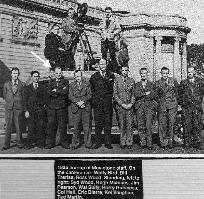 MOVIETONE MEN: An arrow points to Jim Pearson who stands among other cameramen who worked for the newsreel company. The caption in the photo reads '1935 line-up of Movietone staff. On the camera car: Wally bird, Bill Trerise, Ross Wood. Standing, left to right: Syd Wood, Hugh McInnes, Jim Pearson, Wal Sully, Harry Guinness, Col Hell, Eric Bierre, Kel Vaughan, Ted Martin.
