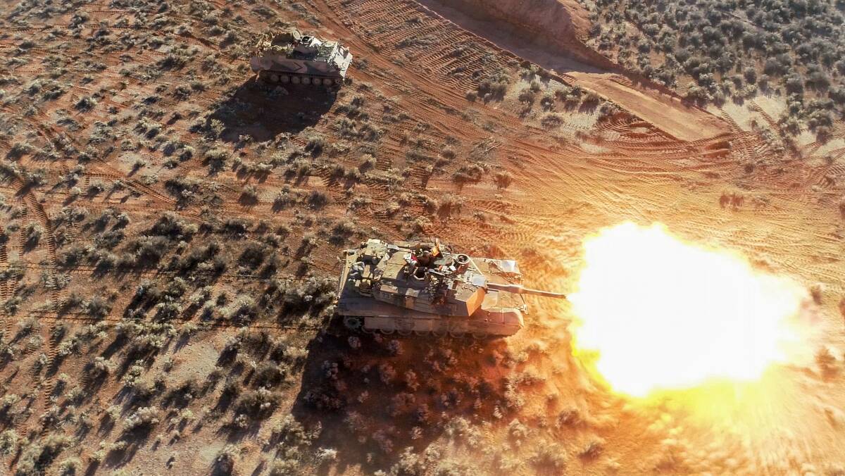 An Australian Army M1A1 Abrams battle tank fires during live-fire training for Exercise Paratus Run last month in South Australia. Picture: Department of Defence