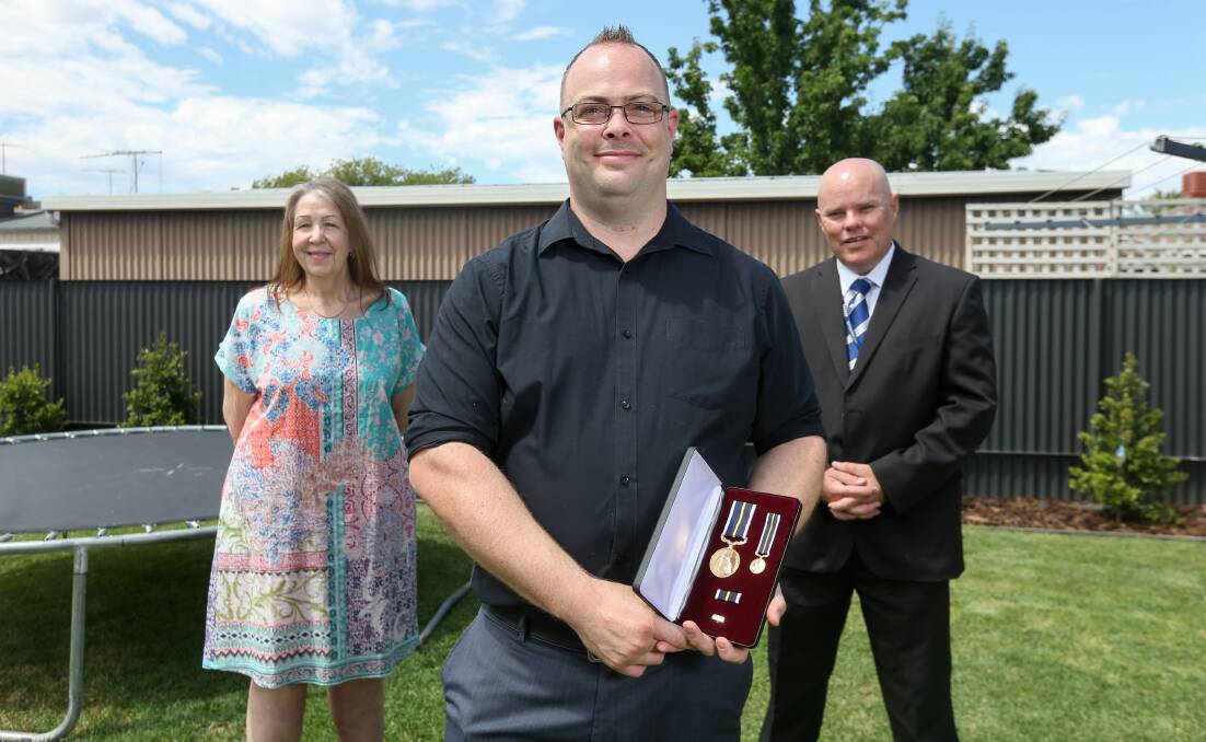 MESSAGE: Luke Chilcott, pictured with Marlene Park and Detective Leading Senior Constable Wade Spokes, hopes his bravery award will be a vehicle for people to seek support for mental health. Picture: TARA TREWHELLA
