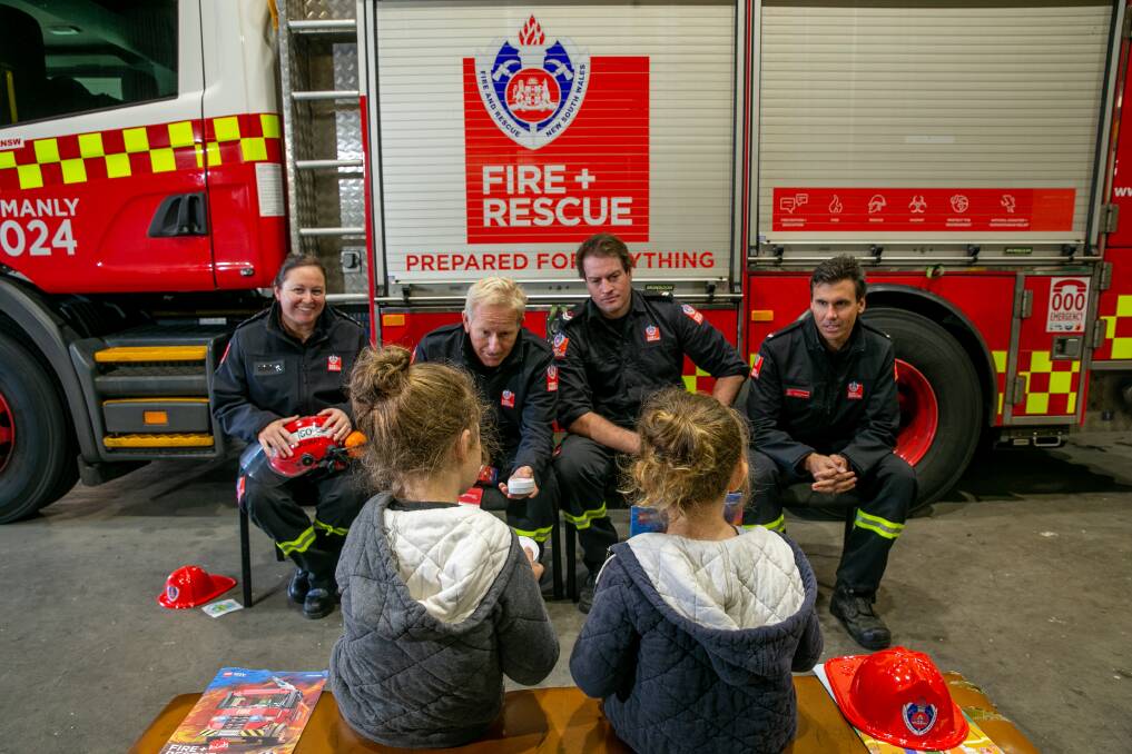 LIFE LESSONS: Fire and Rescue NSW Manly Station Officer Peta Miller with firefighters Jim Randall, Josh Hammond and Scott Hardiman teaching fire safety. Picture: Geoff Jones