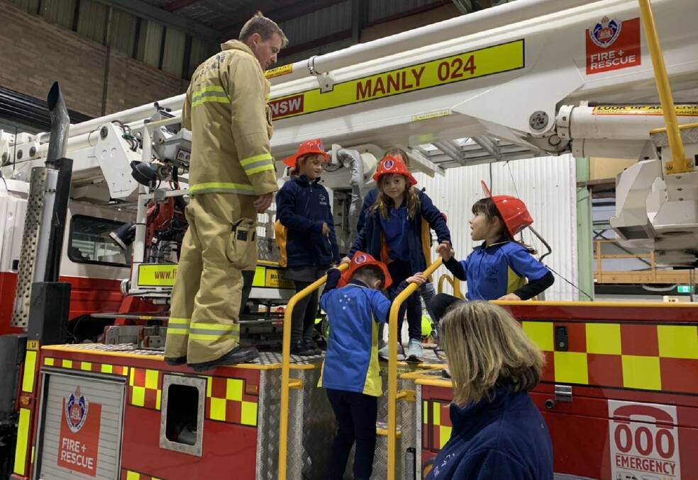 LIFE LESSONS: Manly firefighters teaching fire safety to Freshwater Girl Guides.