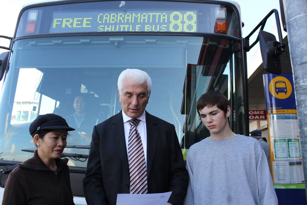 Angered: Cabramatta MP Nick Lalich reads a letter from Transport Minister Gladys Berejiklian to say funding for the free Cabramatta 88 shuttle bus service would be stopped.