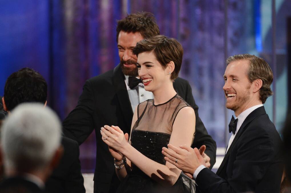 Actors Hugh Jackman, Anne Hathaway, and Adam Shulman attend the 19th Annual Screen Actors Guild Awards. Photo by Mark Davis/Getty Images