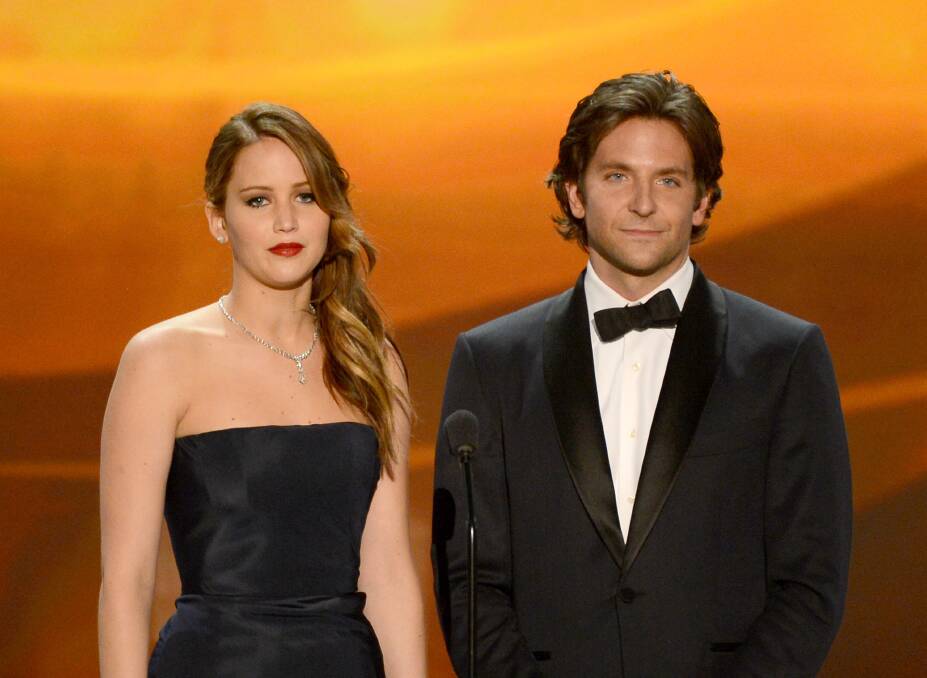 Actors Jennifer Lawrence and Bradley Cooper speak onstage during the 19th Annual Screen Actors Guild Awards. Photo by Mark Davis/Getty Images