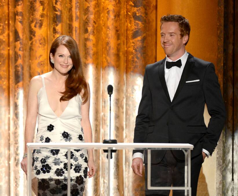 Actors Julianne Moore and Damian Lewis speak onstage during the 19th Annual Screen Actors Guild Awards. Photo by Mark Davis/Getty Images